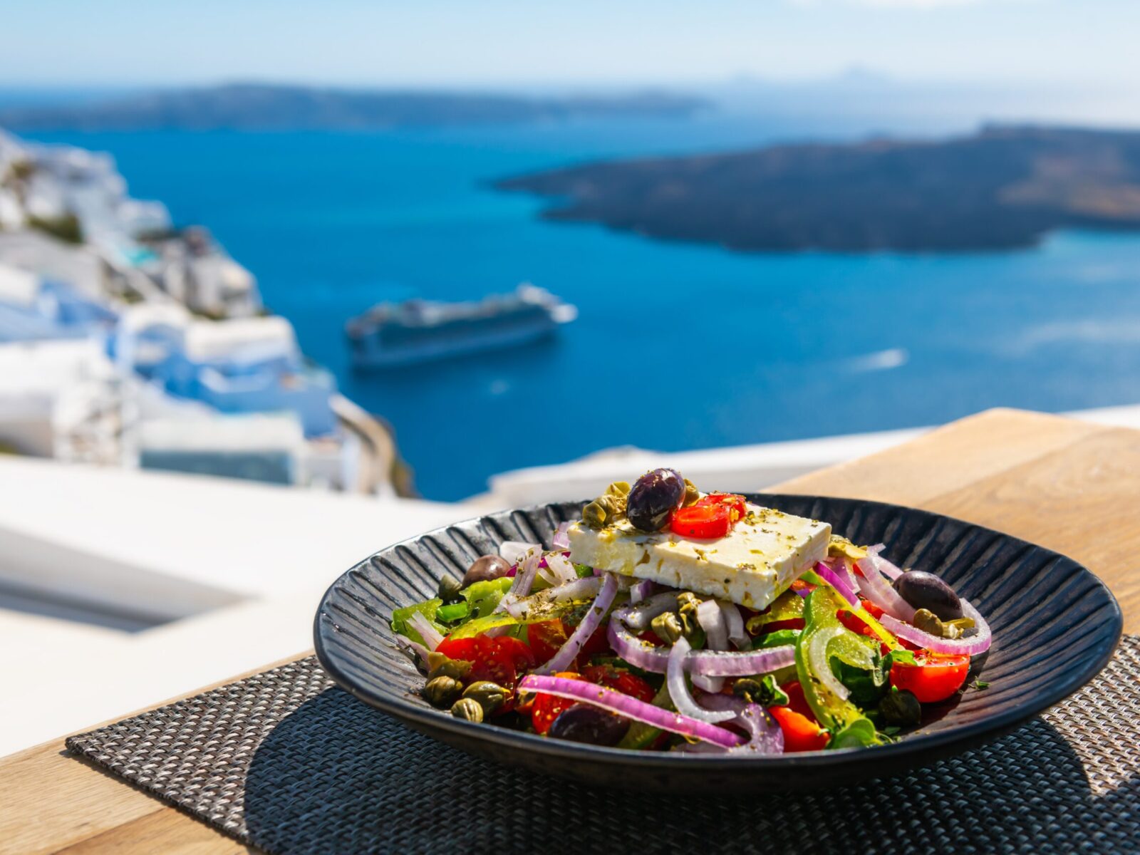 Greek,Salad,With,Beautiful,Sea,View,In,Santorini,Island,,Greece.