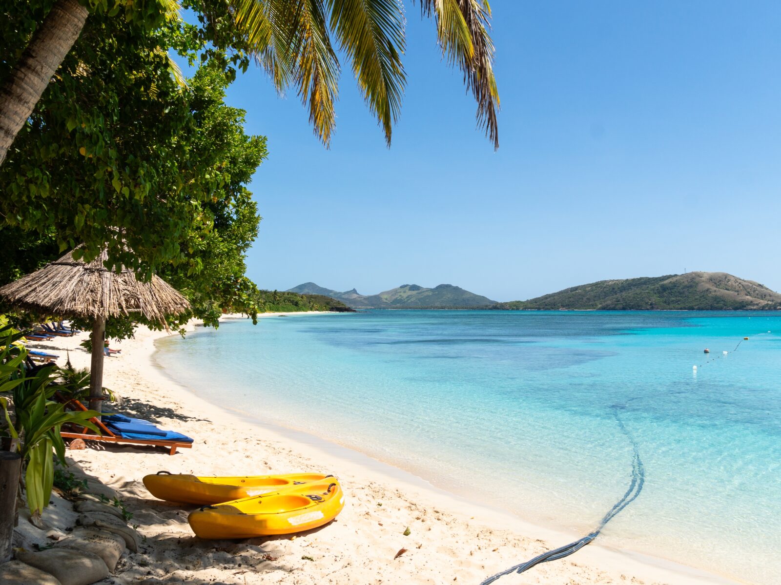 Yasawa,,Fiji:,Idyllic,Beach,With,Palm,Trees,And,Turquoise,Water